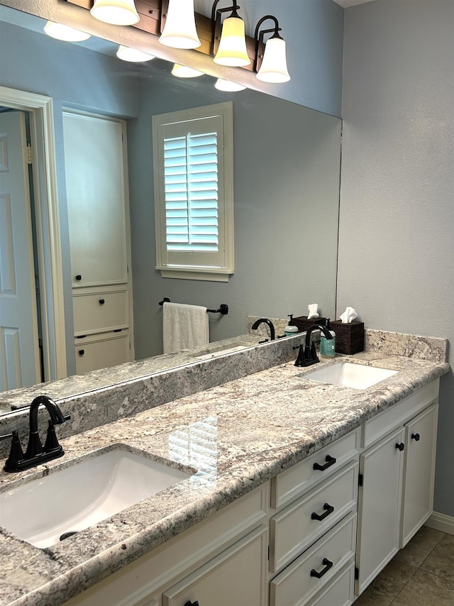 bathroom featuring tile patterned floors and vanity