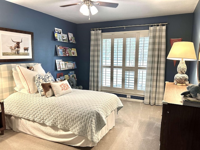 carpeted bedroom with ceiling fan