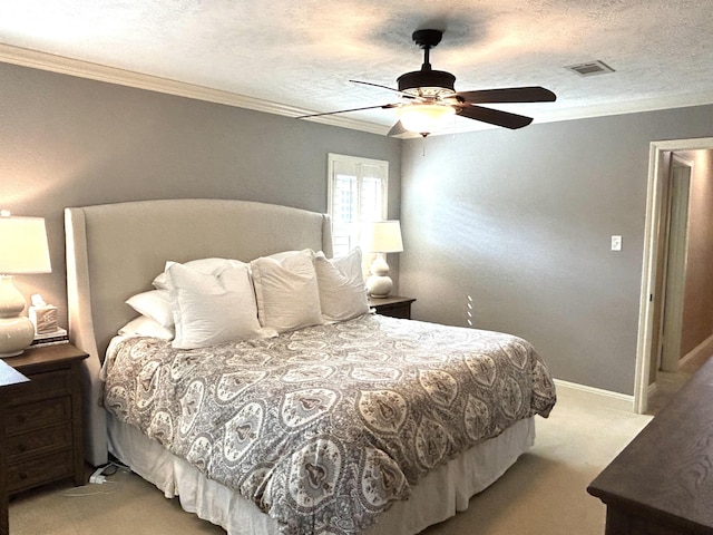 carpeted bedroom with ceiling fan, crown molding, and a textured ceiling