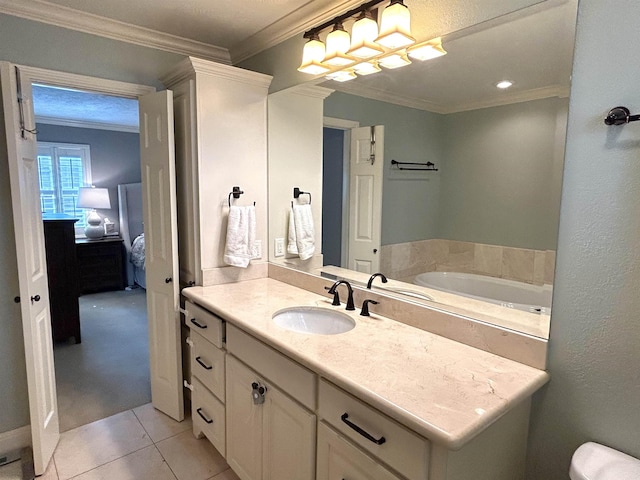 bathroom featuring a bathing tub, crown molding, tile patterned flooring, and vanity