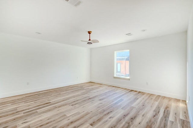 unfurnished room with light hardwood / wood-style flooring