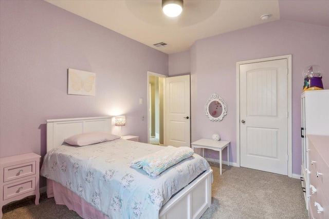 carpeted bedroom featuring ceiling fan, vaulted ceiling, and white refrigerator