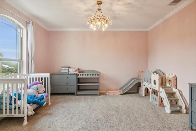 bedroom featuring carpet floors, a crib, multiple windows, and an inviting chandelier