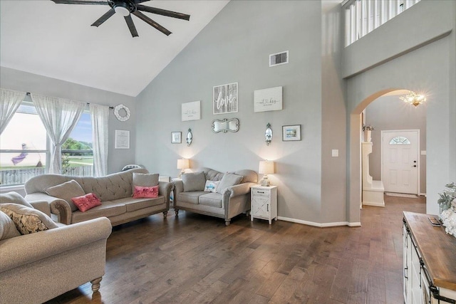 living room with ceiling fan, dark hardwood / wood-style flooring, and high vaulted ceiling