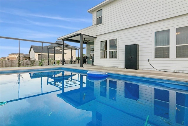 view of pool with a patio area and ceiling fan