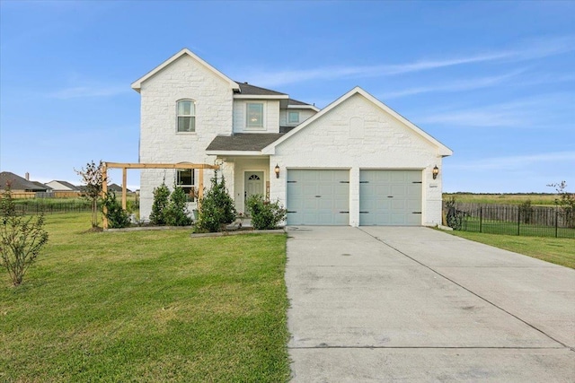 view of front of house with a garage and a front lawn