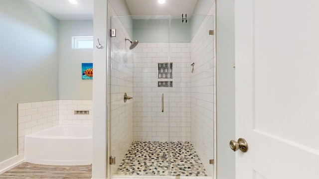 335 Atkinson, Crystal Beach, TX 77650 - full bath featuring a shower stall, a bath, wood finished floors, and recessed lighting