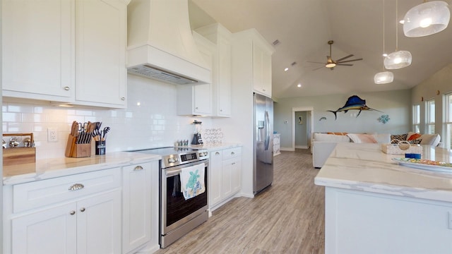 335 Atkinson, Crystal Beach, TX 77650 - kitchen featuring custom range hood, appliances with stainless steel finishes, open floor plan, backsplash, and vaulted ceiling
