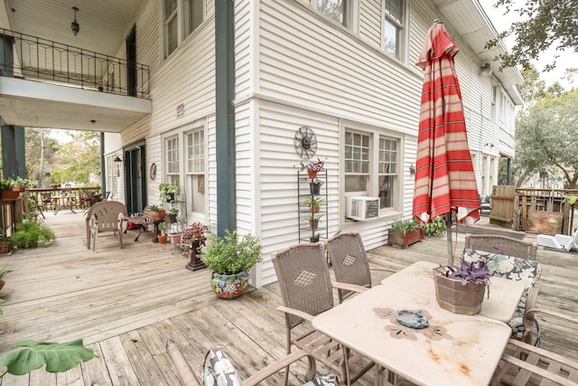 2350 Pecos Blvd, Beaumont, TX 77702 - wooden deck featuring outdoor dining space and cooling unit