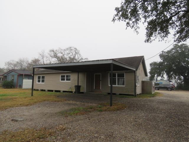 ranch-style home with a carport