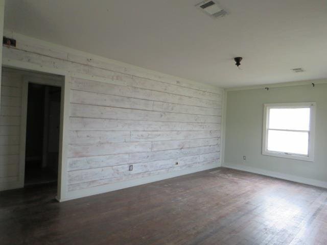 unfurnished room featuring dark hardwood / wood-style flooring