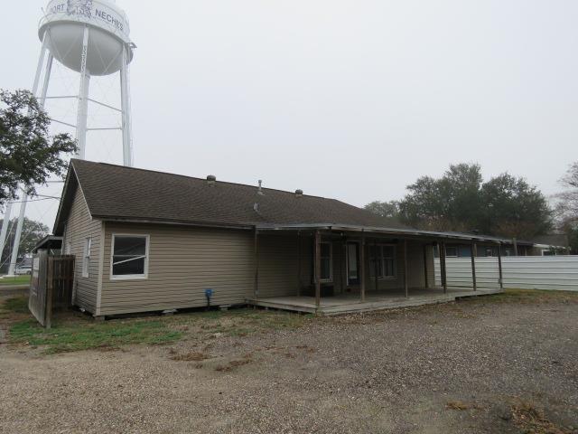 back of property with a patio