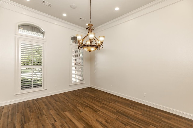 empty room with ornamental molding, dark hardwood / wood-style flooring, and a notable chandelier