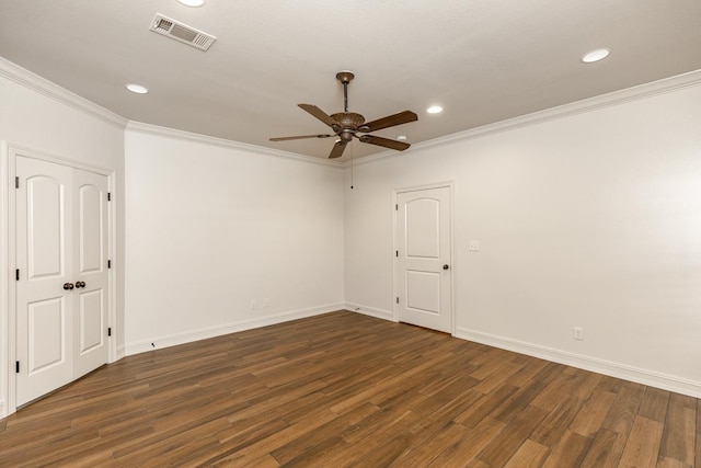 spare room featuring ornamental molding, dark hardwood / wood-style floors, and ceiling fan