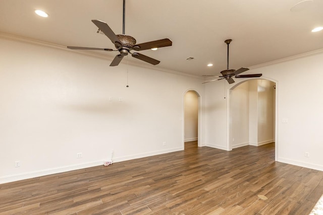 unfurnished living room featuring wood-type flooring, ornamental molding, and ceiling fan