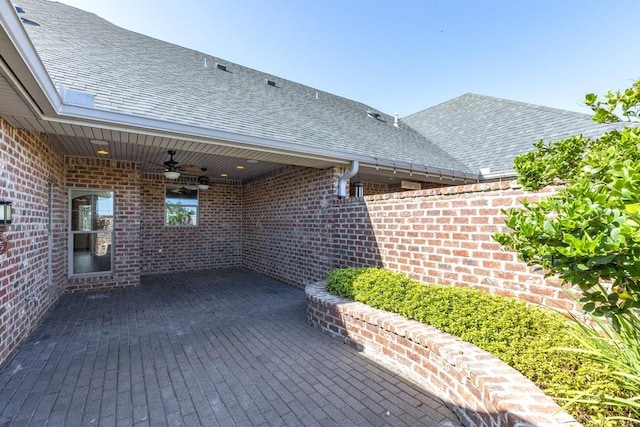 view of patio featuring ceiling fan