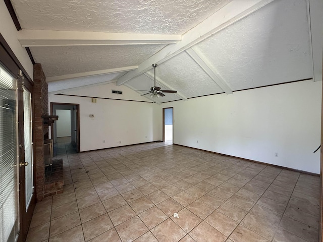 spare room featuring visible vents, vaulted ceiling with beams, light tile patterned floors, a textured ceiling, and ceiling fan