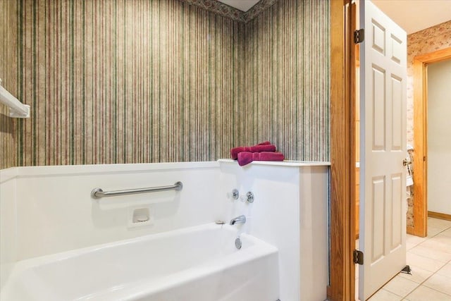 bathroom featuring tile patterned floors and a tub