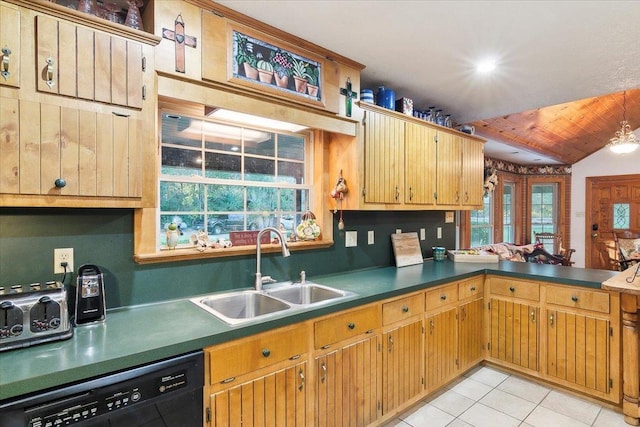 kitchen featuring light tile patterned flooring, sink, lofted ceiling, and black dishwasher