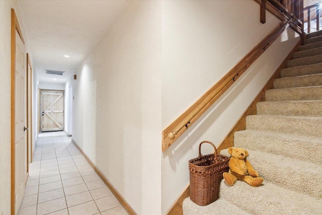 hallway with light tile patterned flooring