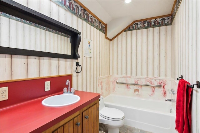 bathroom featuring vanity, lofted ceiling, a bath, tile patterned flooring, and toilet