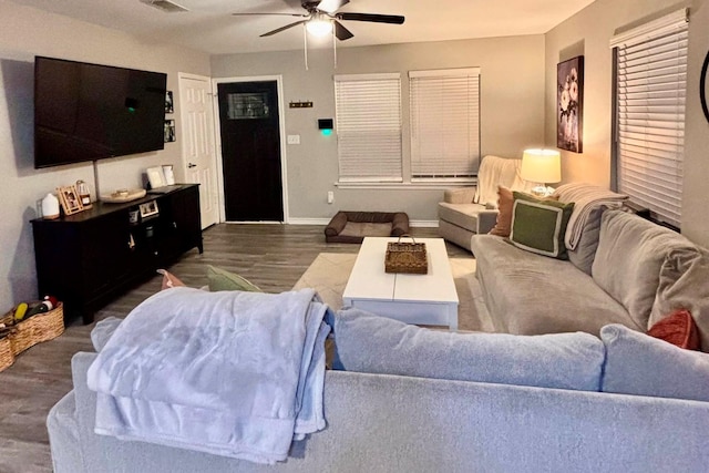 living room with dark hardwood / wood-style floors and ceiling fan