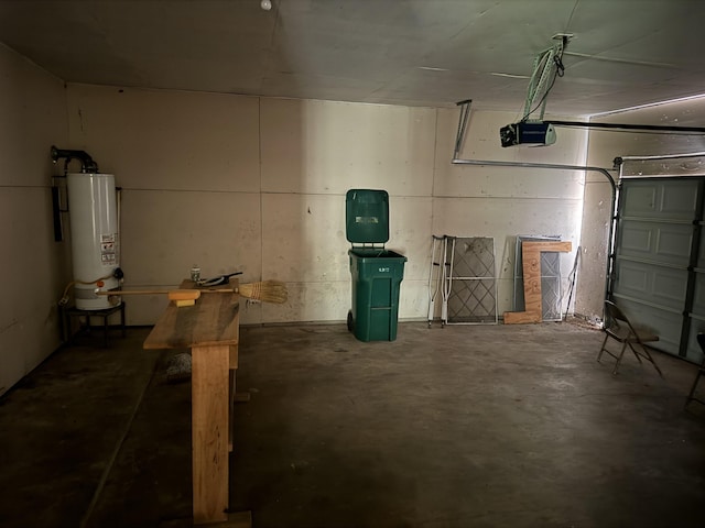 garage featuring water heater and a garage door opener