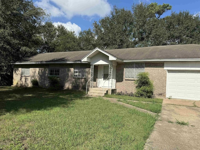 ranch-style home featuring a front lawn, brick siding, and an attached garage