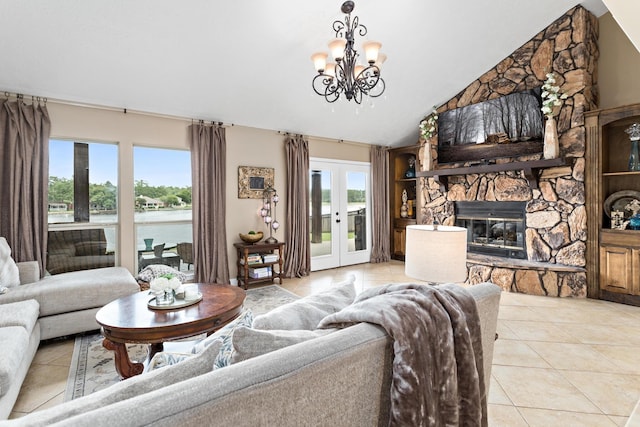 134 Hornbeam, Village Mills, TX 77663 - living room featuring light tile patterned flooring, lofted ceiling, a chandelier, a fireplace, and french doors