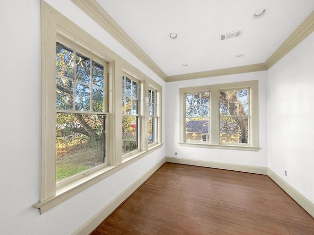 unfurnished sunroom featuring visible vents