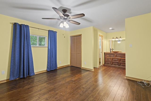 3042 Parish Cemetery Rd, Little Cypress, TX 77632 - unfurnished bedroom featuring wood finished floors and a ceiling fan