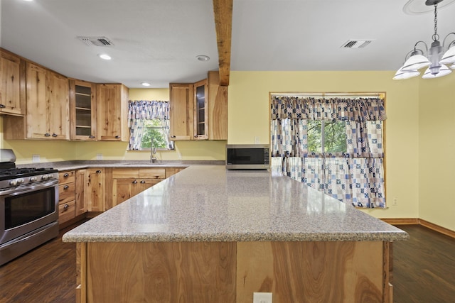 3042 Parish Cemetery Rd, Little Cypress, TX 77632 - kitchen with appliances with stainless steel finishes, dark wood-style flooring, a peninsula, light stone counters, and a chandelier