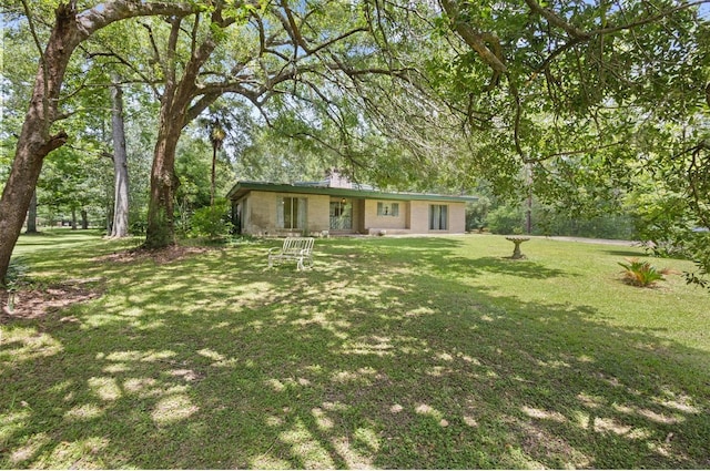3042 Parish Cemetery Rd, Little Cypress, TX 77632 - view of front of property featuring a front yard