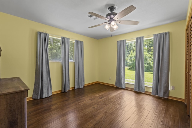 3042 Parish Cemetery Rd, Little Cypress, TX 77632 - spare room with dark wood-style flooring and a ceiling fan