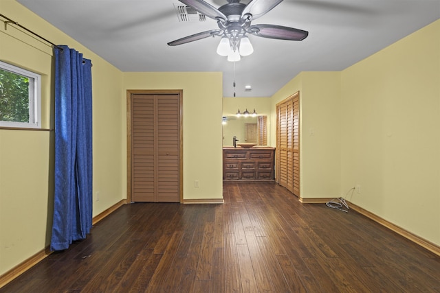 3042 Parish Cemetery Rd, Little Cypress, TX 77632 - unfurnished bedroom with wood-type flooring and a ceiling fan