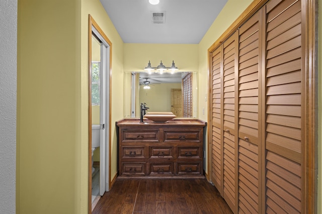 3042 Parish Cemetery Rd, Little Cypress, TX 77632 - hall featuring dark wood-type flooring and a sink
