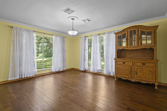 3042 Parish Cemetery Rd, Little Cypress, TX 77632 - spare room with plenty of natural light, ornamental molding, and dark wood-style flooring