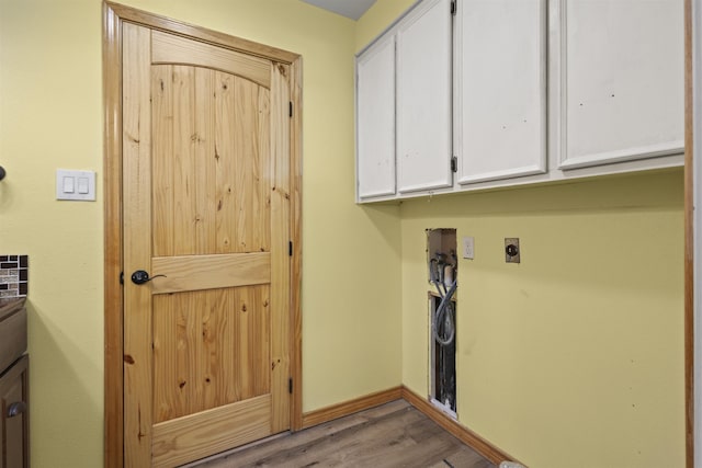 3042 Parish Cemetery Rd, Little Cypress, TX 77632 - laundry room with hookup for an electric dryer, cabinet space, washer hookup, and wood finished floors