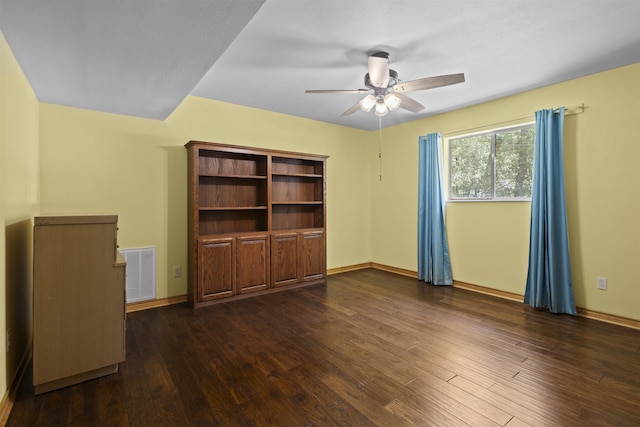 3042 Parish Cemetery Rd, Little Cypress, TX 77632 - empty room with ceiling fan and dark wood-type flooring