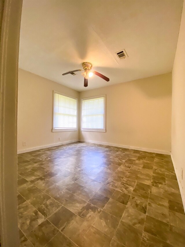 unfurnished room featuring ceiling fan