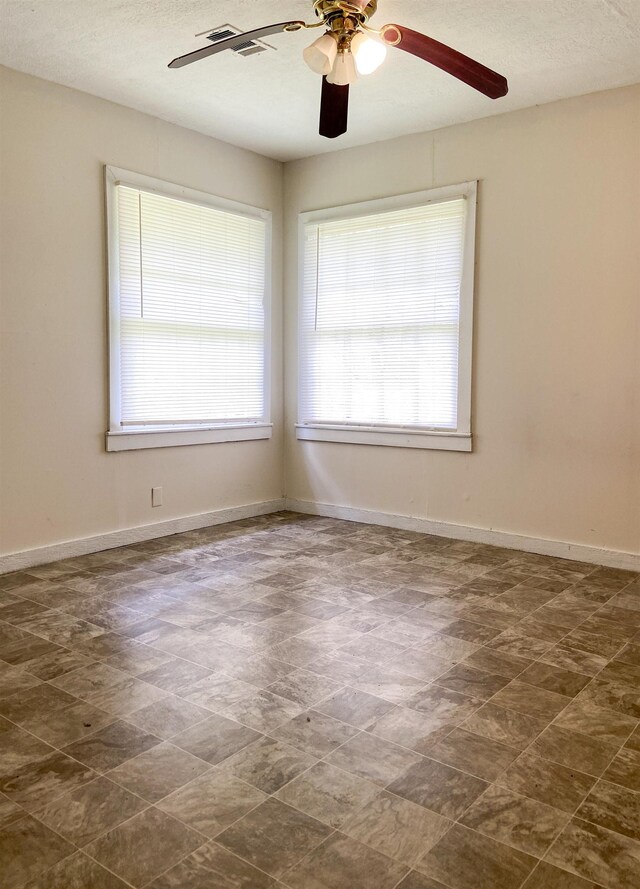 empty room with ceiling fan