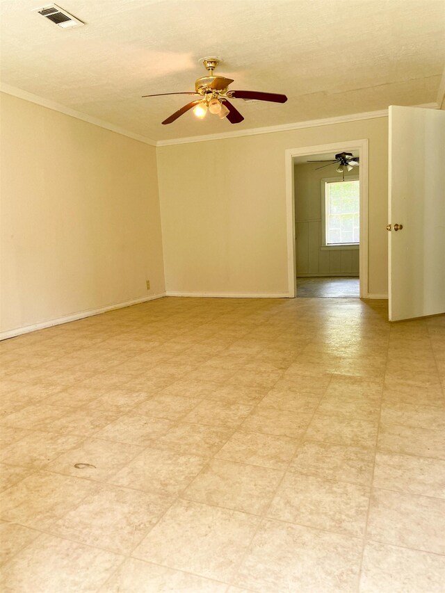spare room featuring crown molding