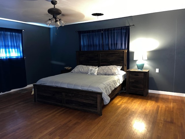 bedroom featuring wood-type flooring and ceiling fan