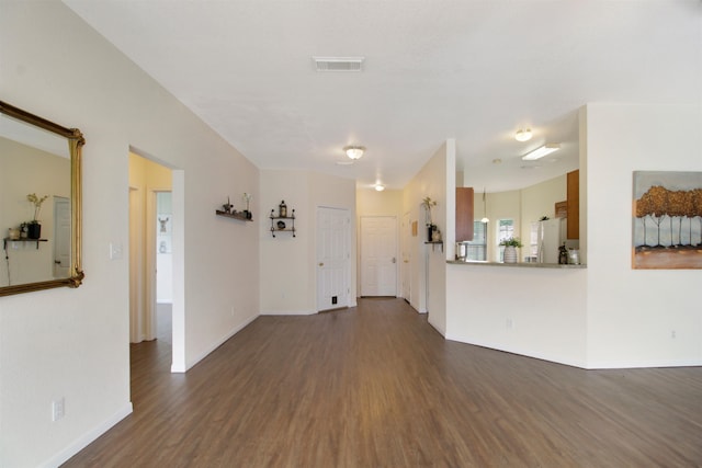 465 Lytton Dr, Vidor, TX 77662 - unfurnished living room featuring dark wood-type flooring and baseboards