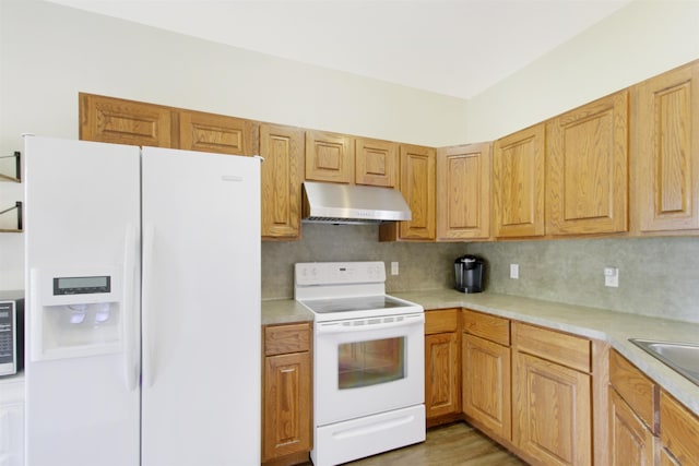 465 Lytton Dr, Vidor, TX 77662 - kitchen with white appliances, under cabinet range hood, light countertops, and decorative backsplash