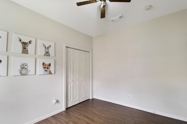 465 Lytton Dr, Vidor, TX 77662 - unfurnished bedroom featuring dark wood finished floors, a closet, and a ceiling fan