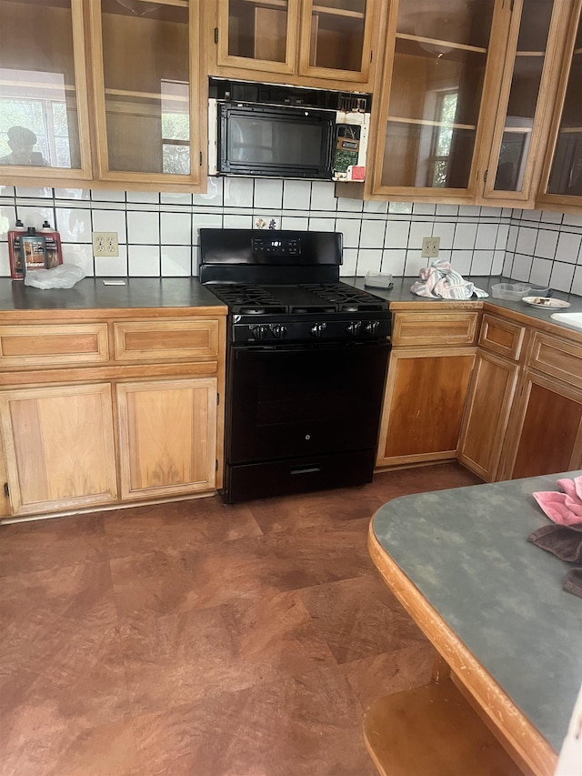 kitchen featuring backsplash and black appliances