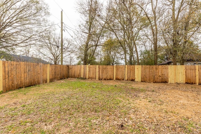 view of yard with a fenced backyard