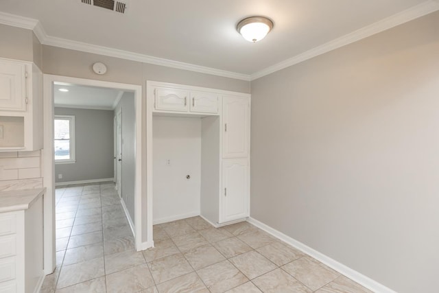 unfurnished bedroom with crown molding, baseboards, and visible vents