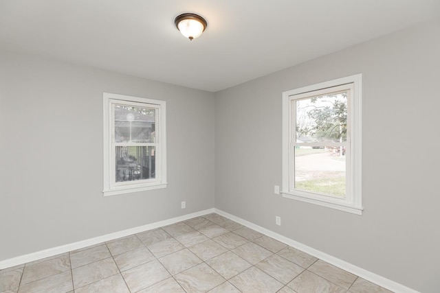 empty room with baseboards